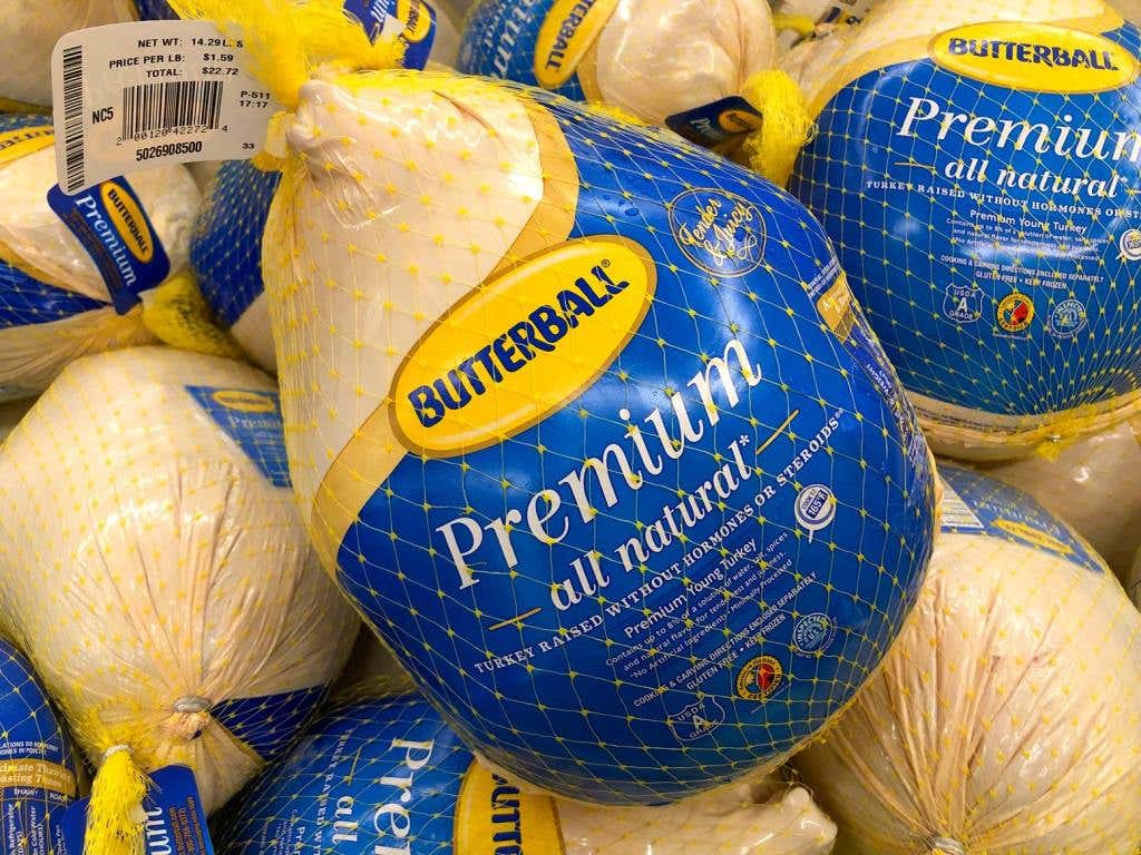 Grocery store freezer shelf with Butterball brand frozen turkeys.