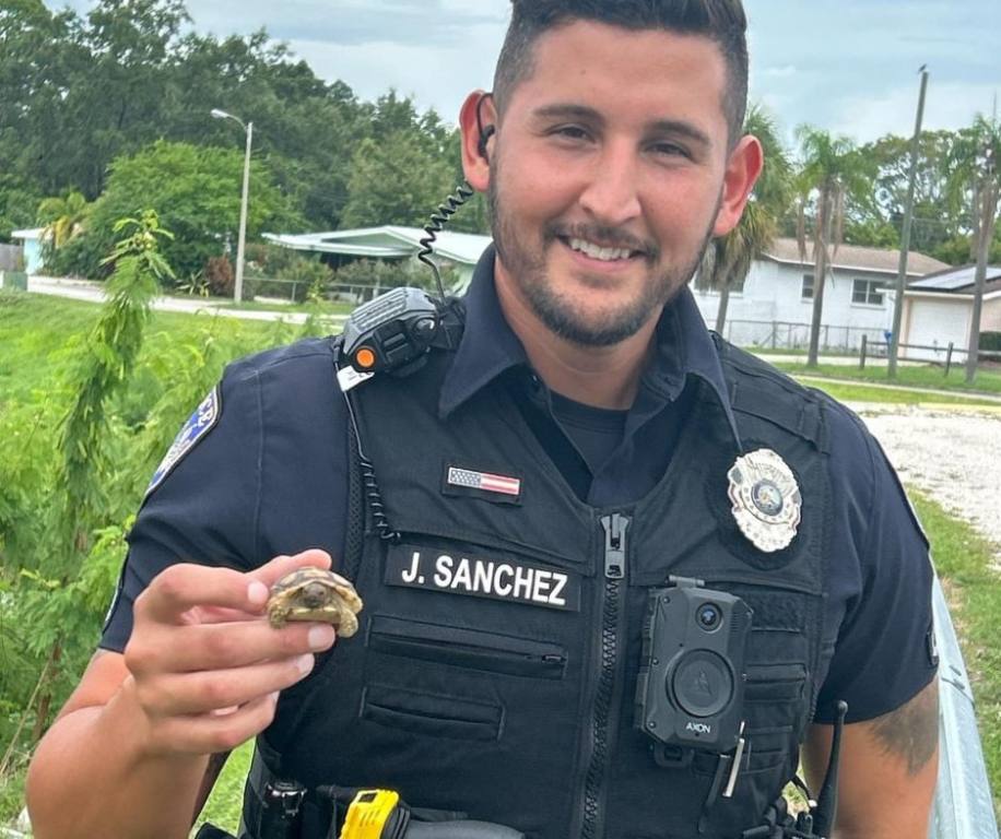 Officer holding gopher tortoise.