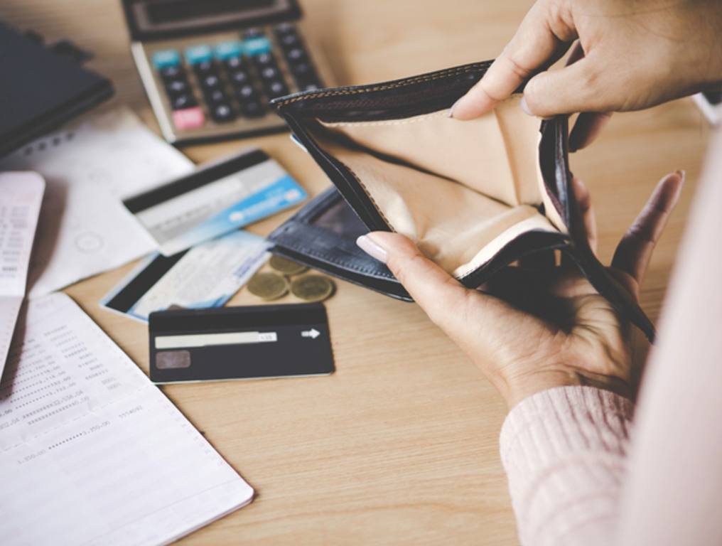 woman hand open empty purse looking for money having problem bankrupt broke after credit card payday, financial freedom, debt concept.