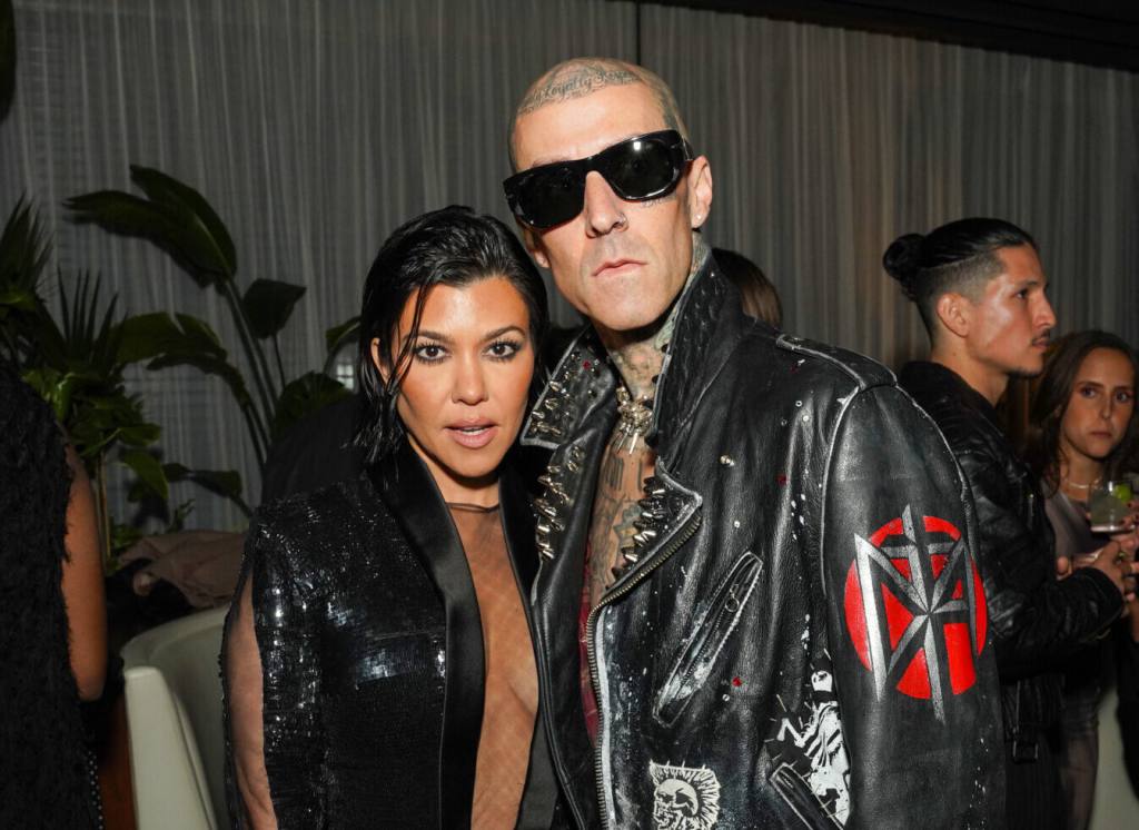 Kourtney Kardashian Barker and Travis Barker attend the GQ Men of the Year Party 2022 wearing leather jackets.