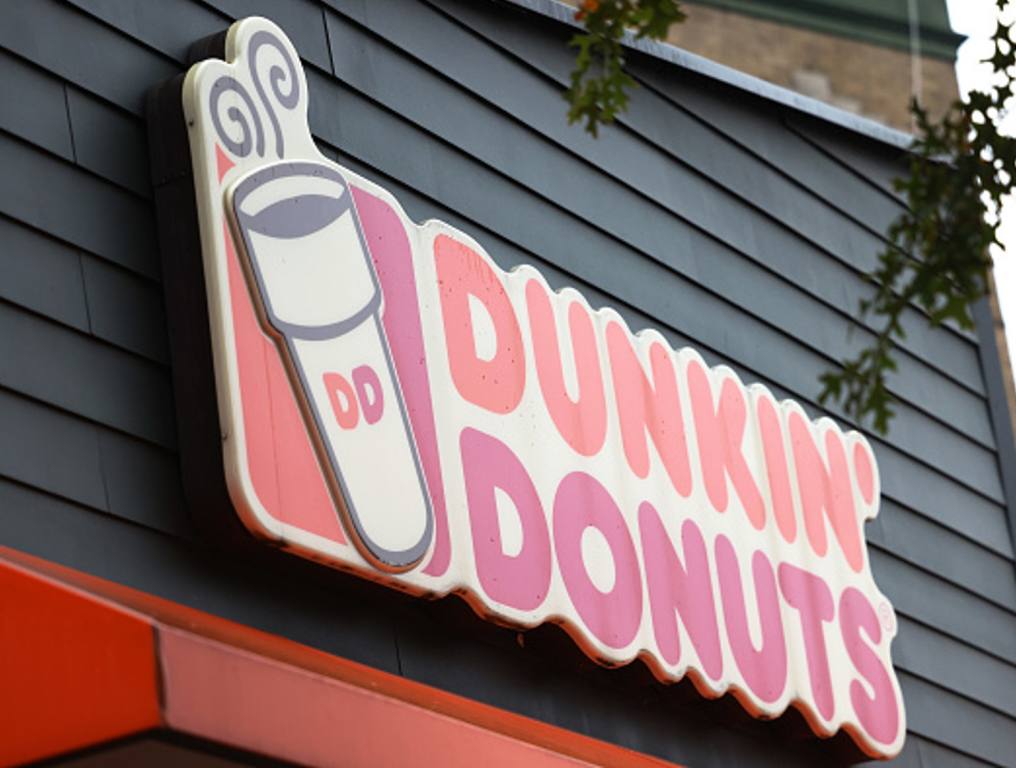 A Dunkin' storefront sign is seen on October 26, 2020 in New York City. The Dunkin’ Brands