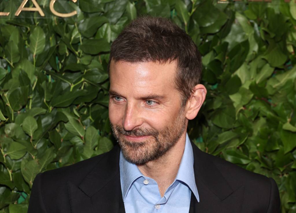 Bradley Cooper attends the 33rd Annual Gotham Awards turning left wearing a blue collared shirt under a black blazer.