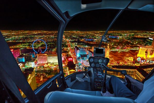 View of Las Vegas at night from the cockpit of a helicopter