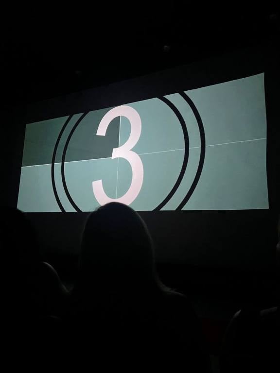 a black and white number 3 on a screen, a countdown to the movie