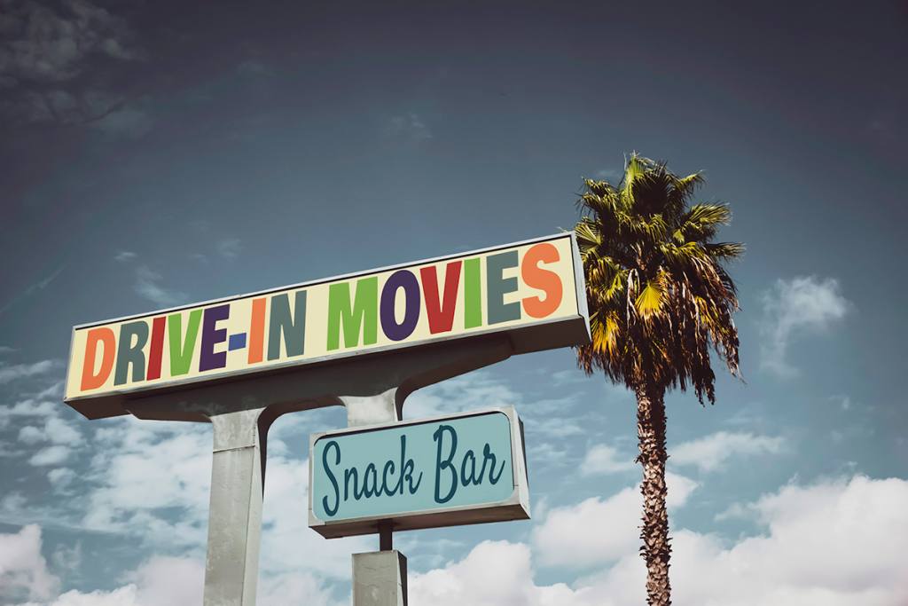 Vintage drive-in movies sign with palm tree. Florida Drive-In Movie Theatres