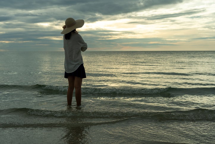 woman on beach dealing with seasonal affective disorder