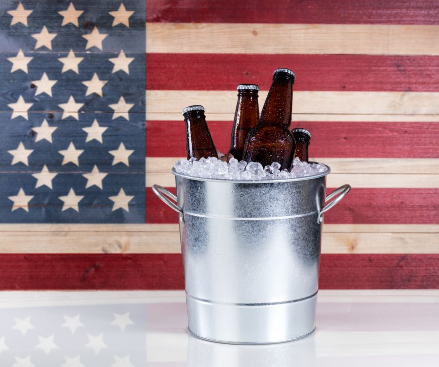 Flag with a bucket of beer bottles for Memorial Day Weekend n Southwest Florida