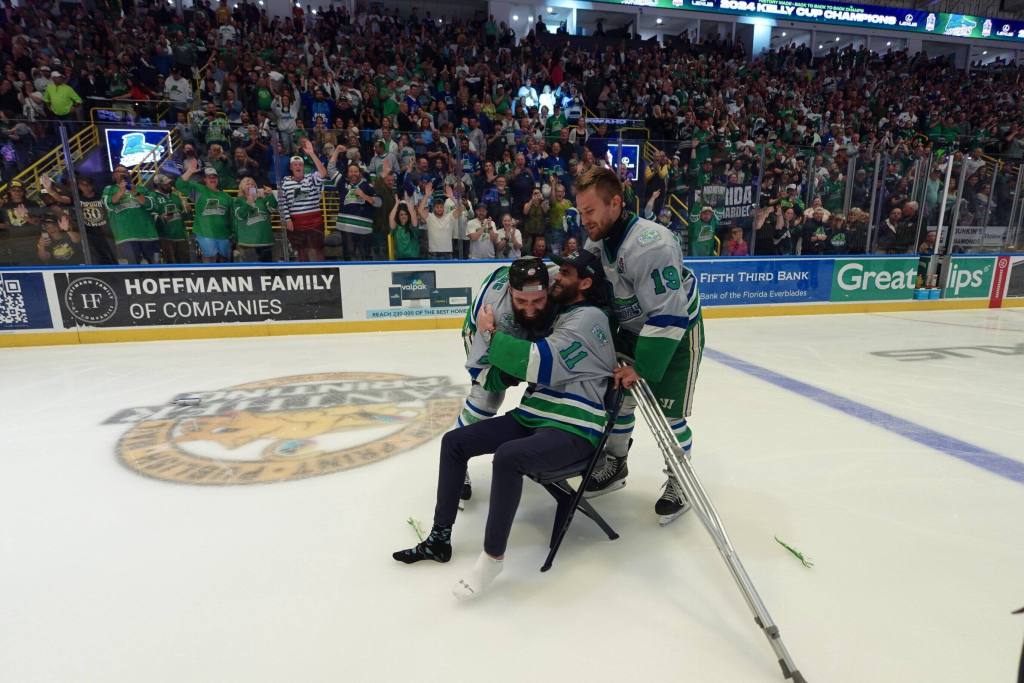 Cam Darcy, Cole Moberg, and Bobo Carpenter after winning the Kelly Cup