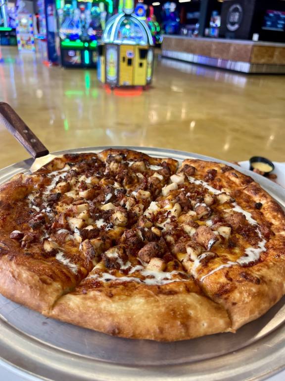 BBQ pizza cut into slices