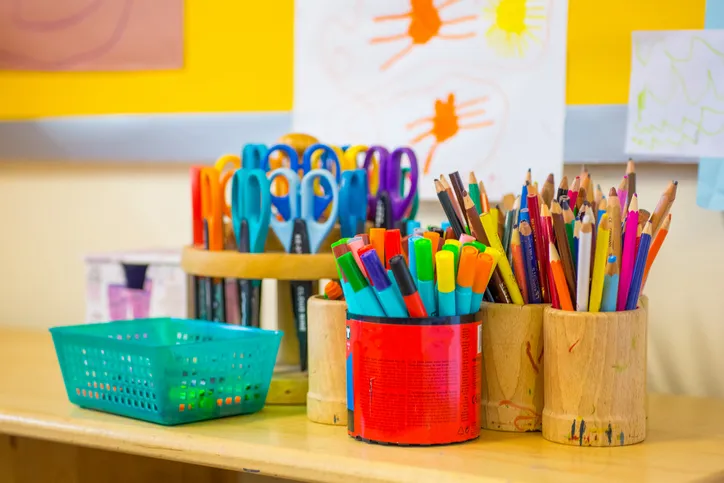 Colouring pens, scissors, pencils on the table in nursery, for back to school shopping in Fort Myers this weekend