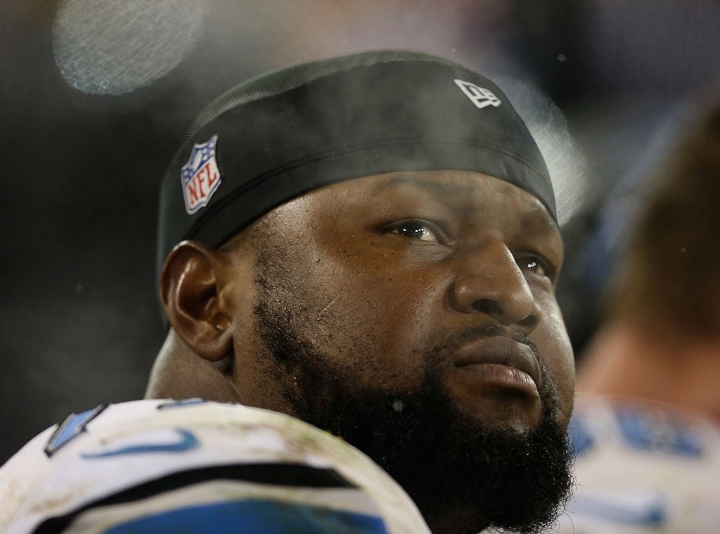 Gosder Cherilus #77 of the Detroit Lions rests on the bench during a agame against the Green Bay Packers at Lambeau Field on December 9, 2012 in Green Bay, Wisconsin. The Packers defeated the Lions 27-20.