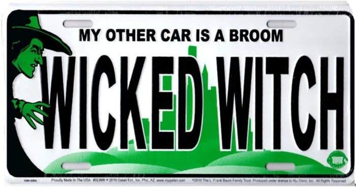 Wicked - Part 1 Decorative License plate with the wicked witch at the left with the words "my other car is a broom WICKED WITCH"