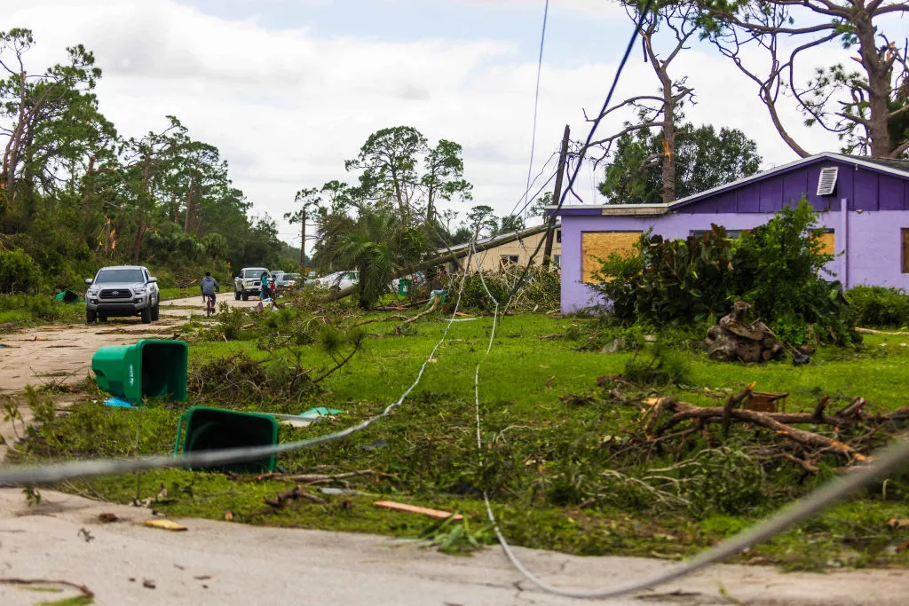 Road ways left damaged and downed power lines by a tornado caused by Hurricane Milton, on October 10, 2024 in Port St Lucie, Florida.