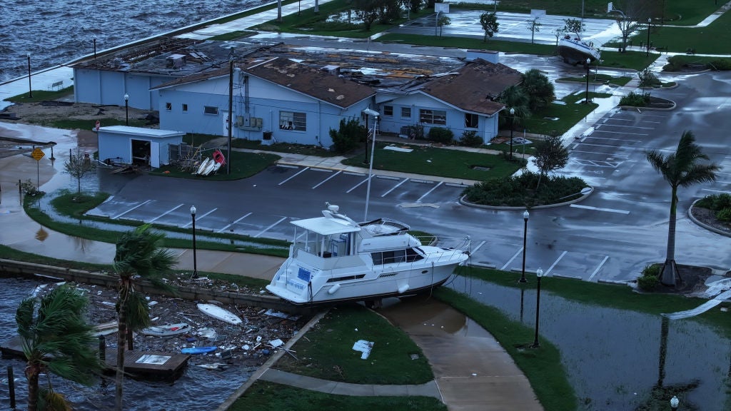 In this aerial view, a boat is washed ashore from when Hurricane Milton passed through the area on October 10, 2024, in Punta Gorda, Florida. The storm made landfall as a Category 3 hurricane in the Siesta Key area of Florida, causing damage and flooding throughout Central Florida.