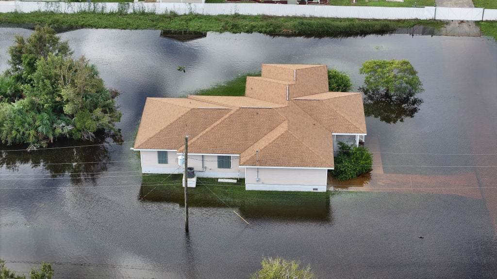 In this aerial view, flood waters inundate a neighborhood after Hurricane Milton came ashore on October 10, 2024, in Punta Gorda, Florida. The storm made landfall as a Category 3 hurricane in the Siesta Key area of Florida, causing damage and flooding throughout Central Florida.