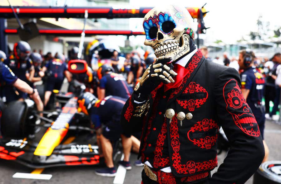 A Dia de los Muertos performer poses for a photo as the Red Bull Racing team practice pitstops during previews ahead of the F1 Grand Prix of Mexico for fun things to do this weekend in Fort Myers and Naples