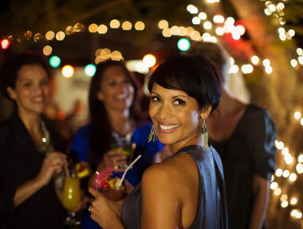 Women partying. If you're single and looking to mingle or just are curious which cities are the best for singles in America, we have you covered.